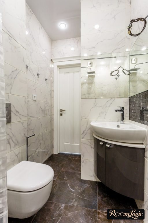 interior combined bathroom with marble-look tile shower