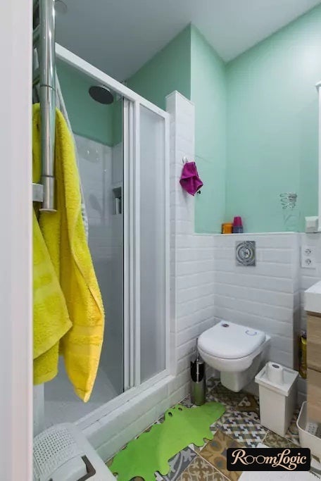 interior of a small combined bathroom and toilet with shower