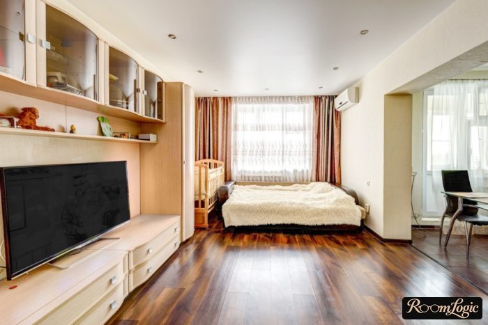 kids' bed crib in studio apartment