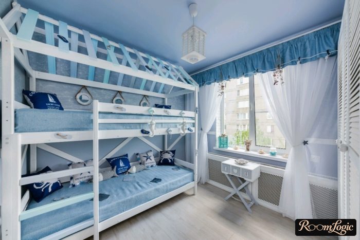 Kids' room for two mixed-gender children in light blue tones