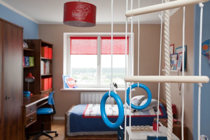 kids' room with wall bars and gymnastic rings