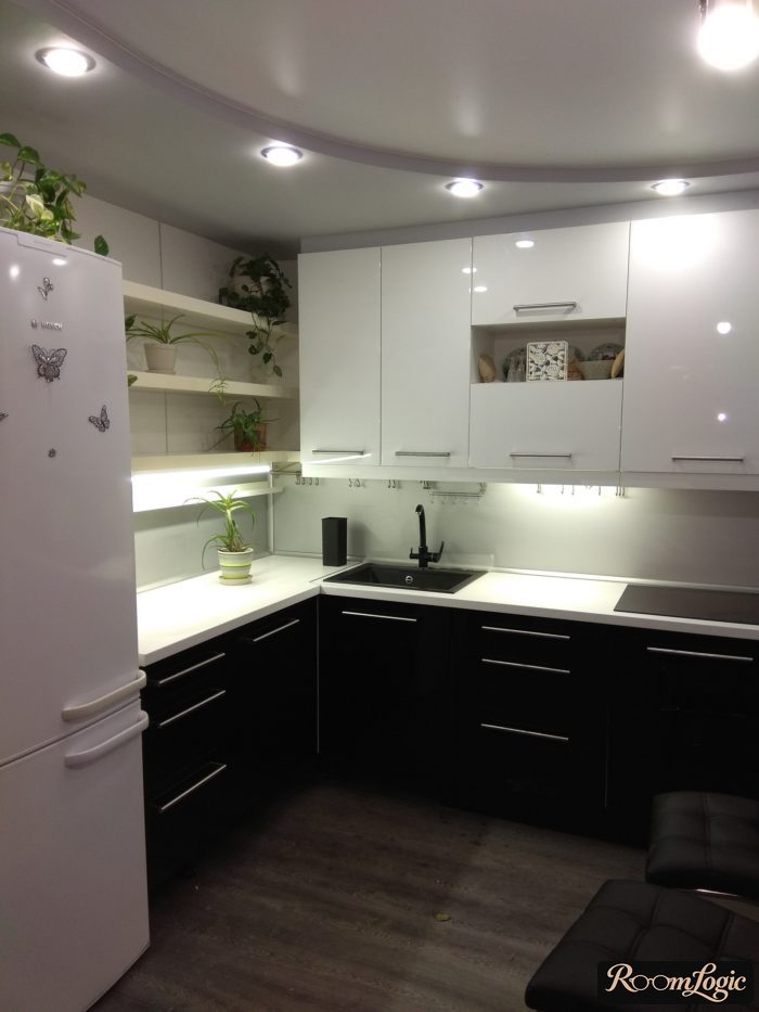 kitchen 100 square feet with refrigerator and sofa