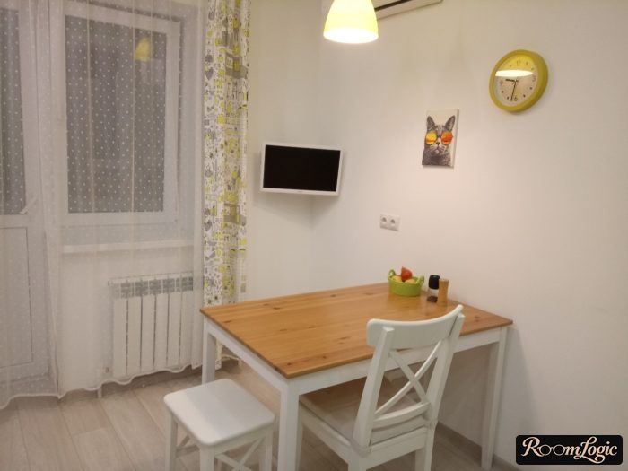 kitchen curtains on one side with balcony door