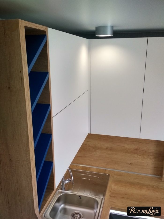 Kitchen design with a gray refrigerator