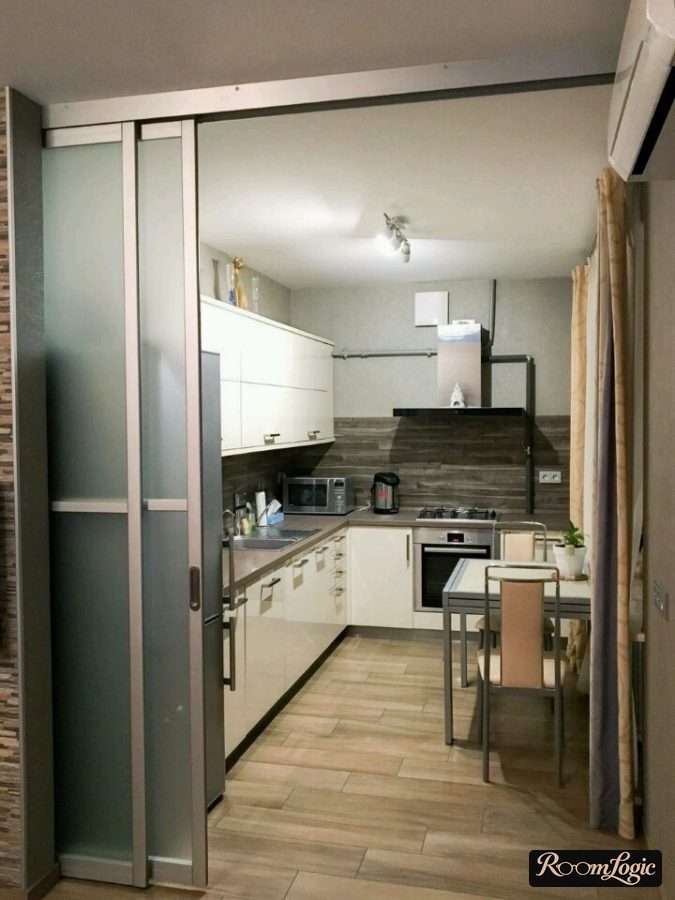kitchen-living room in apartment with gas stove - partition