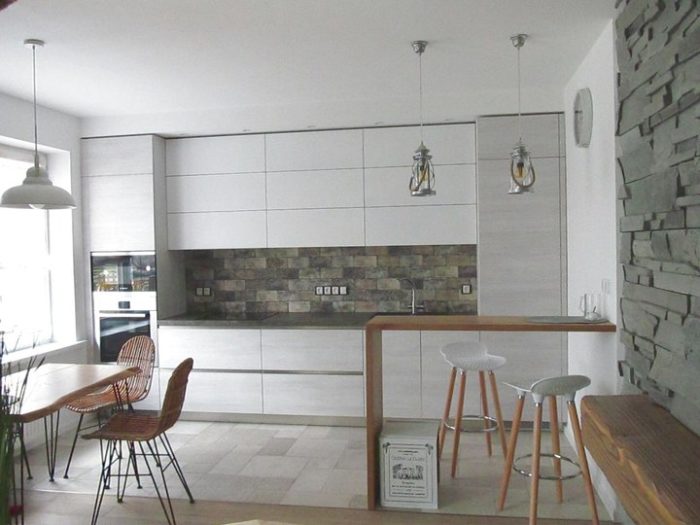kitchen-living room with ceiling-to-floor cabinets