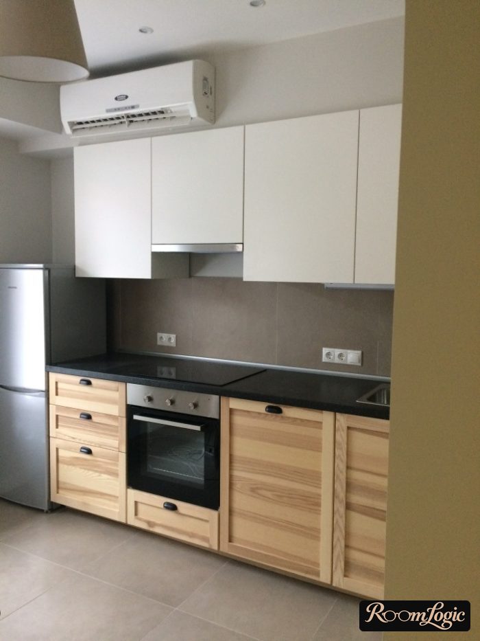 kitchen white matte upper and solid wood with routed detailing below