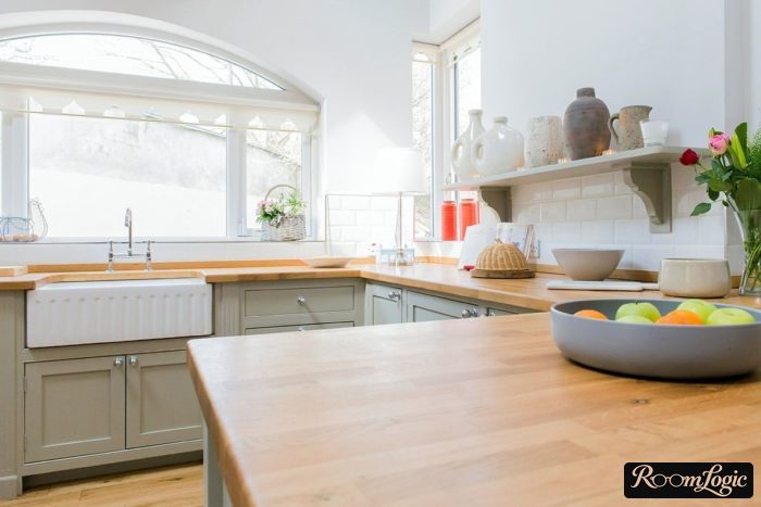 kitchen with a window and open shelves above
