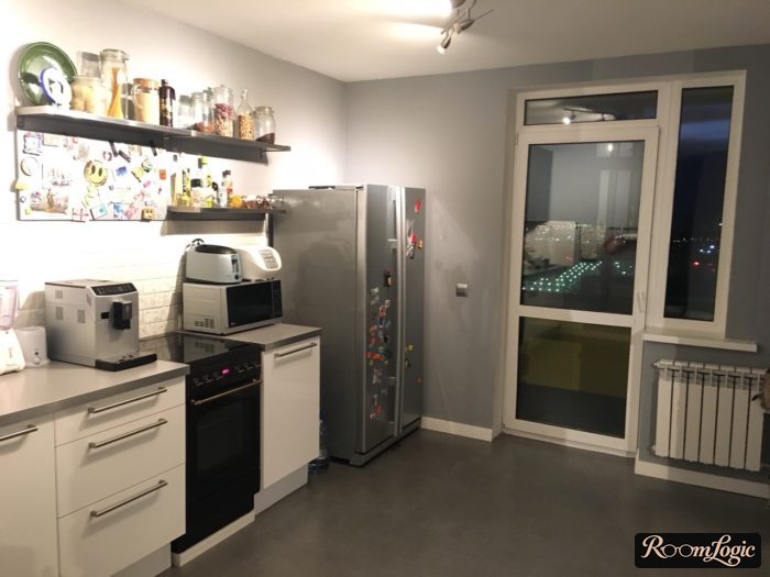 kitchen with balcony door without curtains