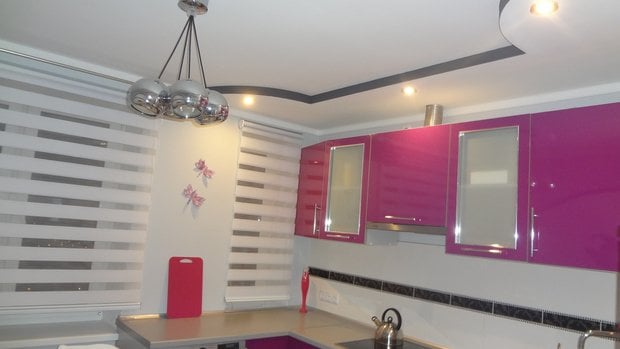 kitchen with bright pink cabinet fronts