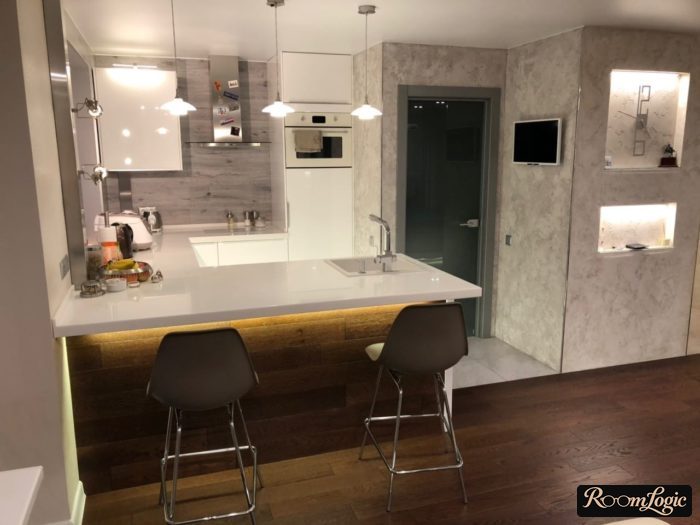 kitchen with white acrylic bar counter and backlight