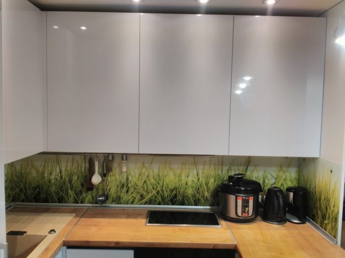 kitchen with white glossy plastic cabinet fronts