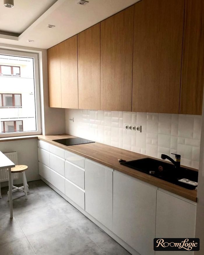 kitchen with white lower cabinets and wooden countertop and upper cabinets
