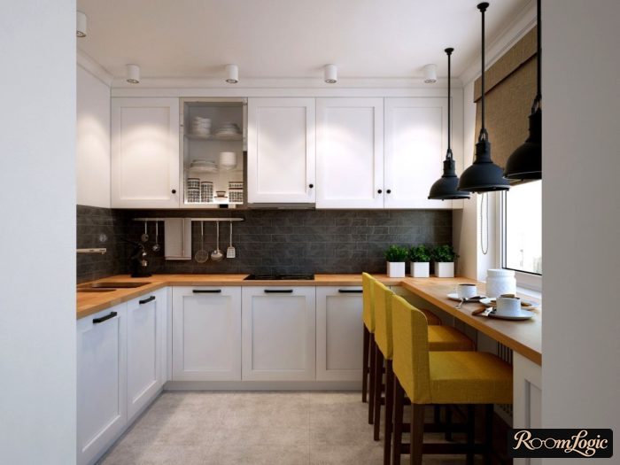 kitchen with white wooden cabinets and wooden countertop and window sill