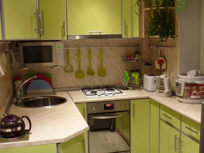 knife and mop hooks on the kitchen wall