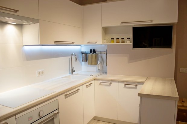 L-shaped white kitchen