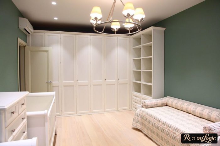 Large floor-to-ceiling wardrobe in a teenage girl's room