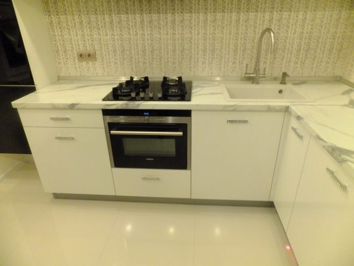 Large square tile on the floor in the kitchen