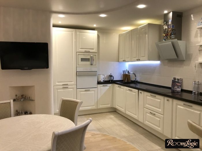 Large white kitchen in neoclassical style