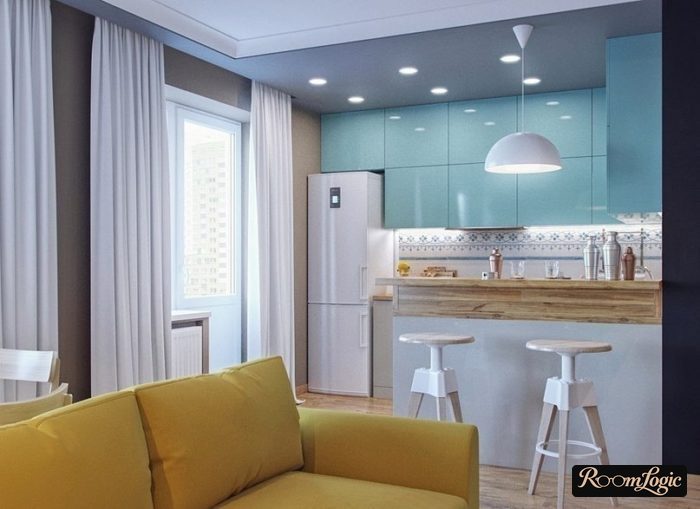 light blue kitchen cabinets and a yellow sofa in the kitchen-living room with a breakfast bar