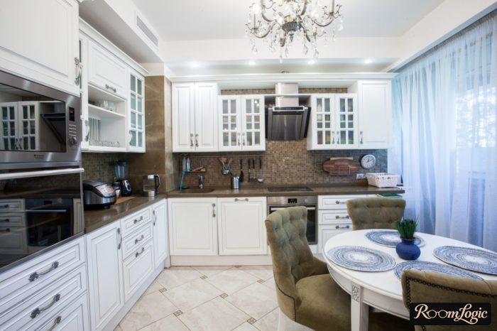 light blue sheer curtain in a white kitchen in a classic style