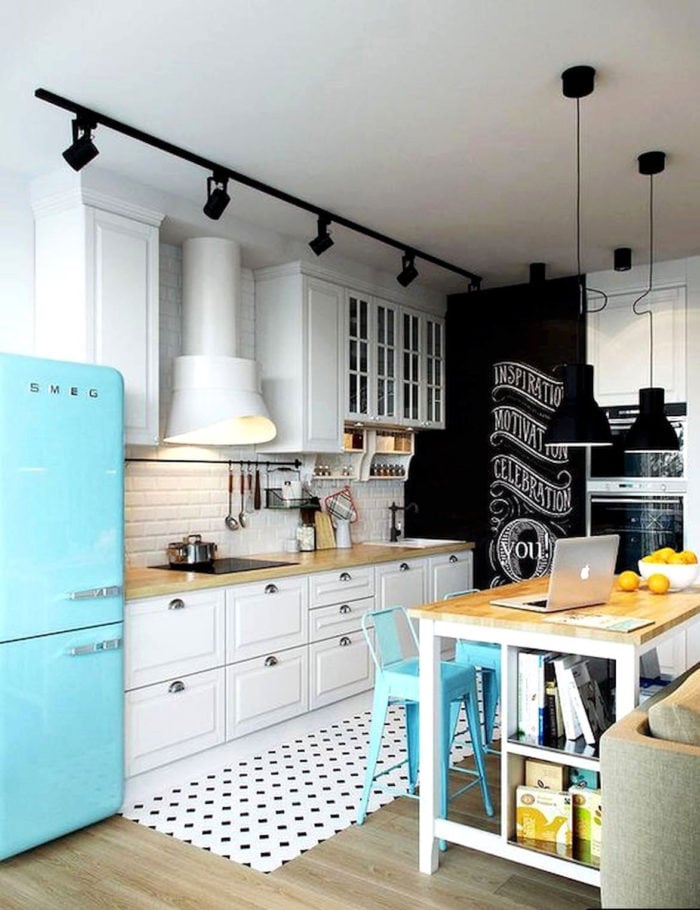 light blue smeg refrigerator in a scandinavian kitchen interior
