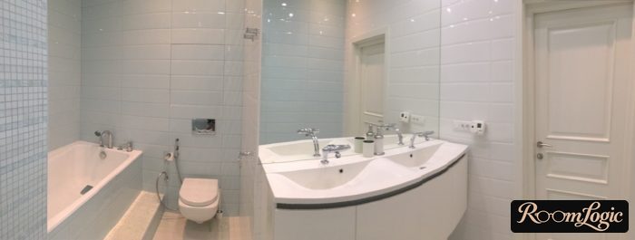 light blue tile in the bathroom with a toilet