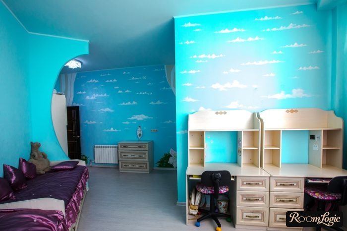 light blue wall paper with clouds in the kids’ room
