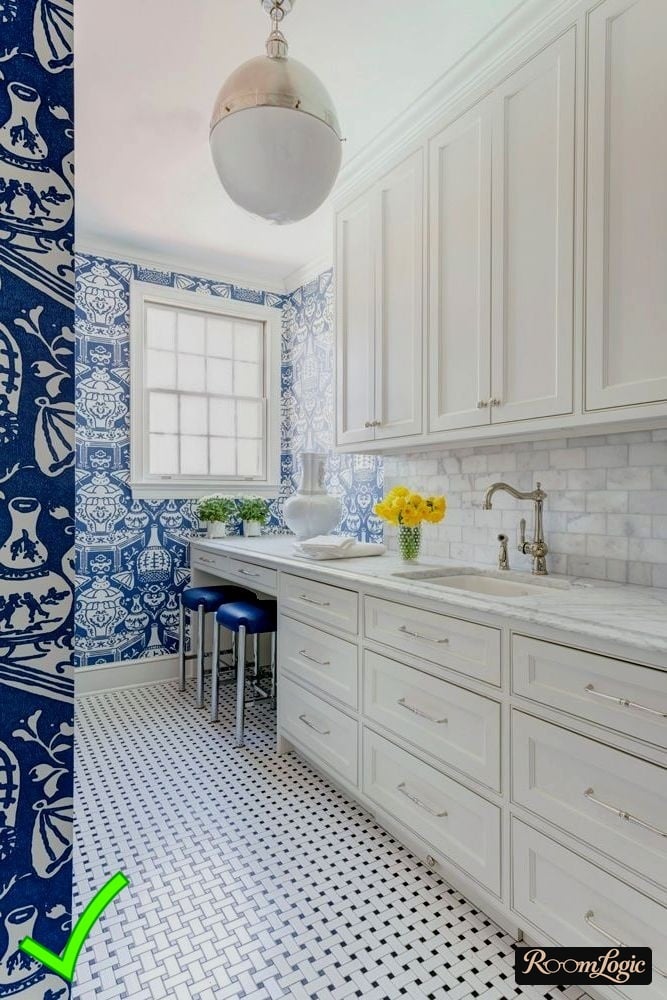 light blue wallpaper with patterns in a white kitchen