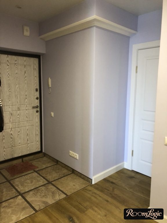 light blue walls in a small entryway