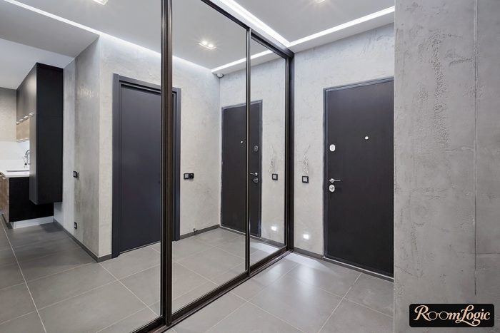 light gray decorative plaster with concrete imitation in the design of a small entryway