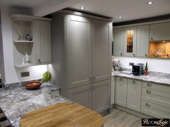 light gray kitchen in neoclassical style with bar counter