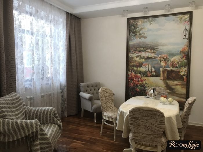 light gray wallpaper and a large painting