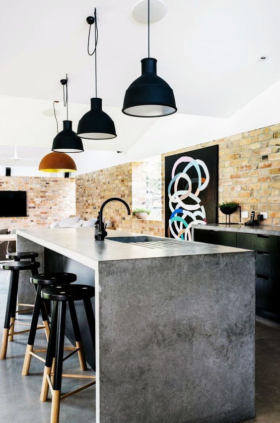 loft-style kitchen with a concrete bar counter