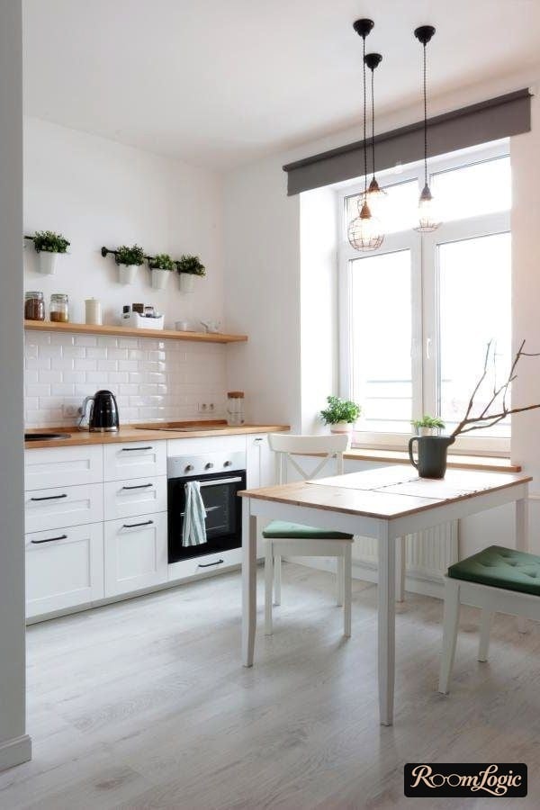 long wooden shelf instead of upper cabinets in white kitchen