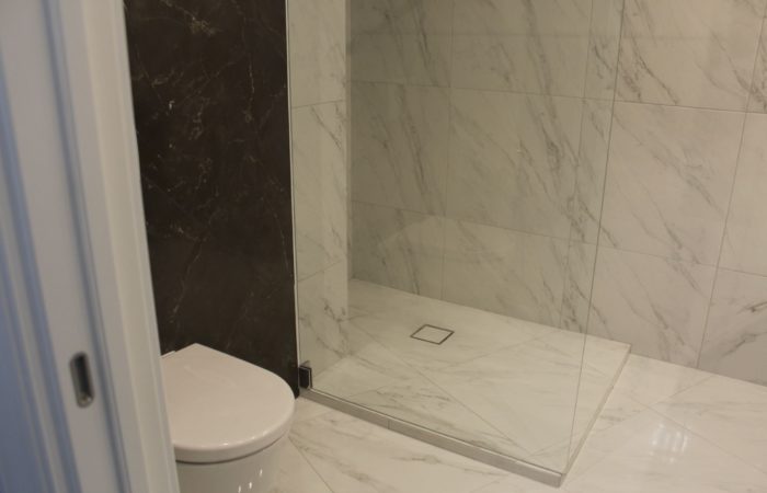 marble-look tile in combined bathroom
