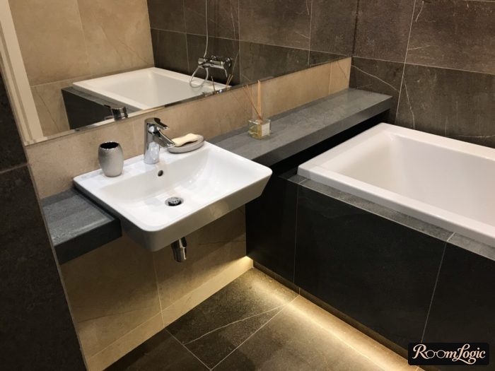 marble-look tile in the interior of a small bathroom