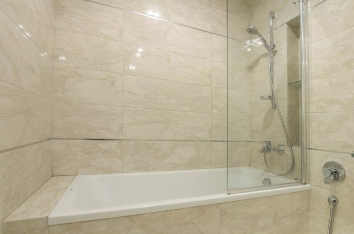 marble-look tile on all walls