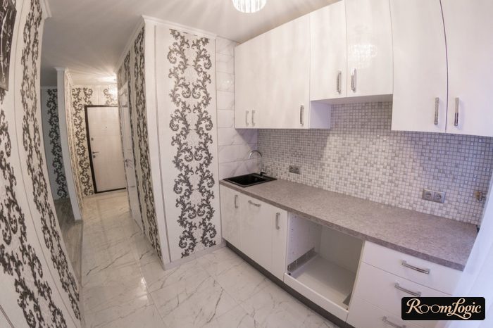 marble-look tile on the kitchen and hallway floor