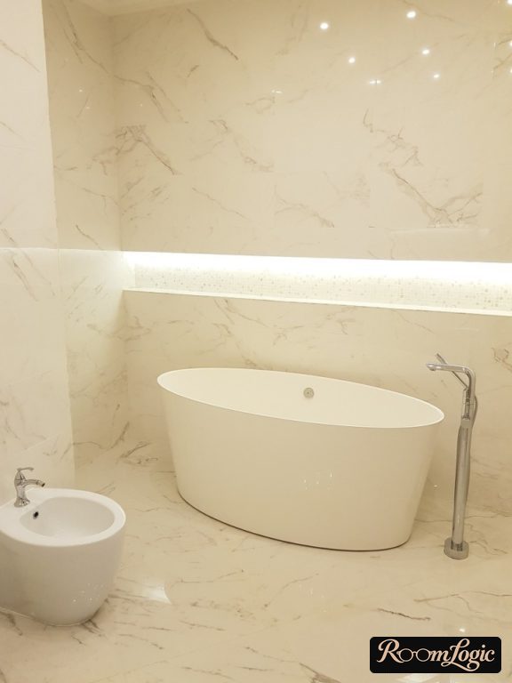 marble-look tile throughout the bathroom