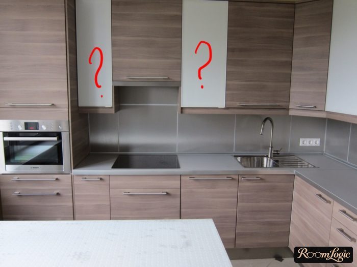Matte glass inserts in the upper cabinet fronts of a small kitchen