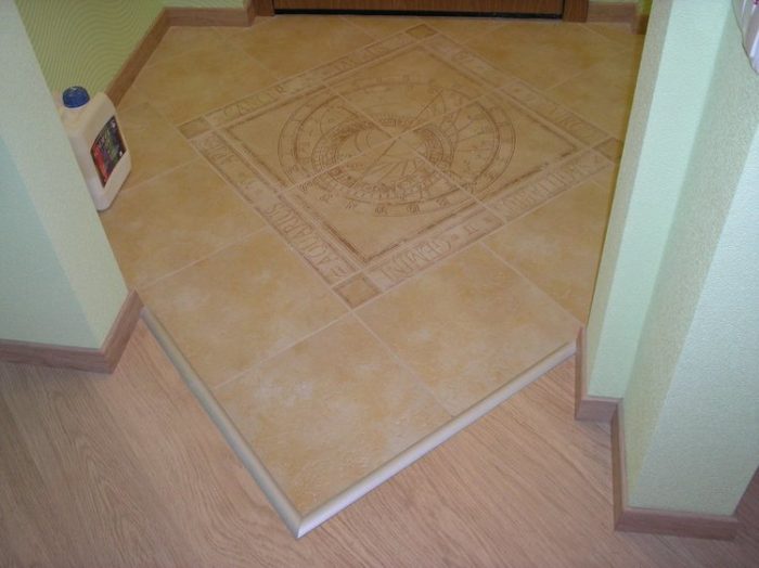 metal threshold between tile and laminate