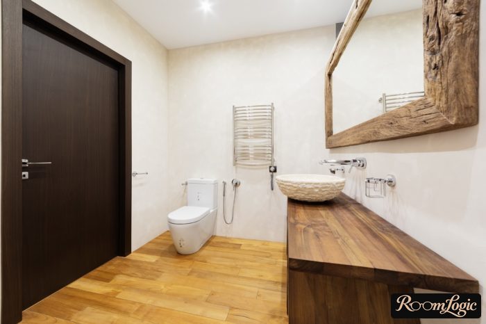 mirror frame and wooden vanity in the bathroom