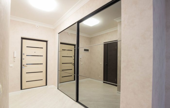 mirror sliding-door wardrobe in entryway