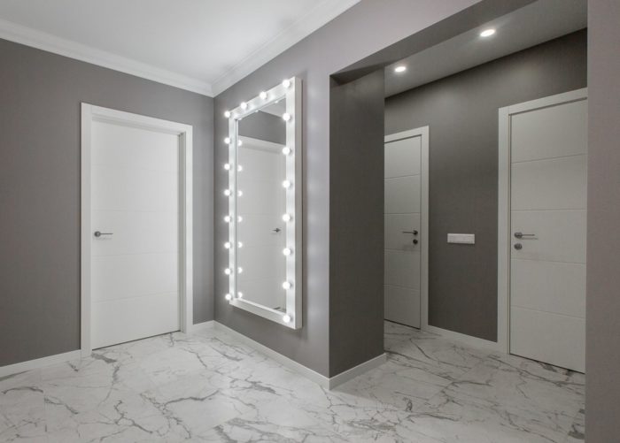 mirror with lamps in hallway