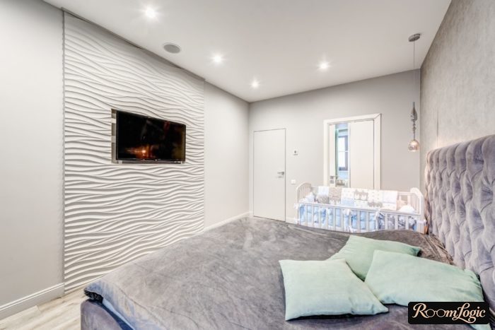 modern bedroom with infant crib