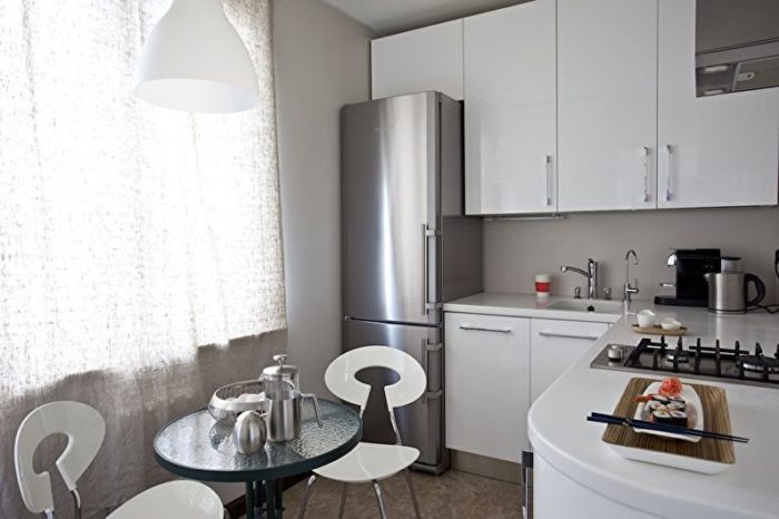 modern corner kitchen in a tiny apartment
