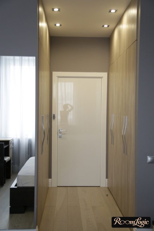 modern furniture in gray tones with wood in a small hallway