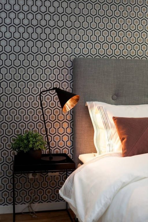 modern interior with black and gold wallpaper
