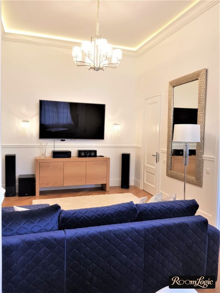 modern living room with a recessed ceiling with lighting